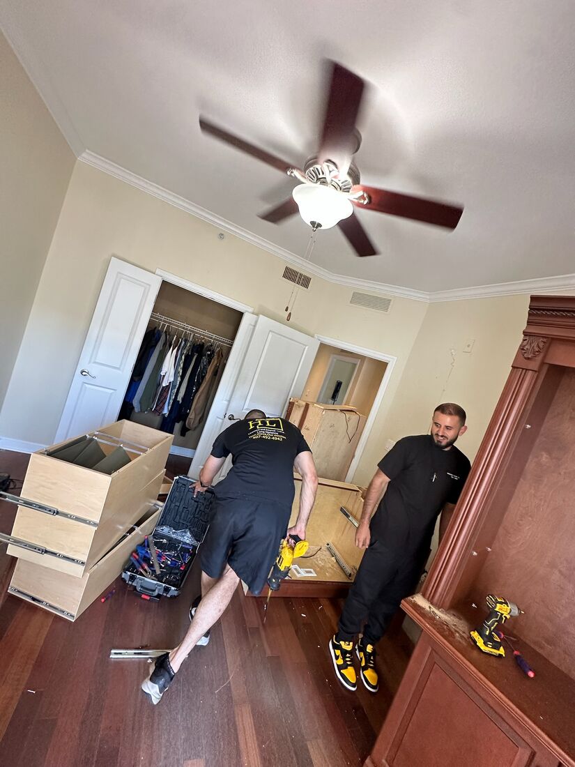 Heavy Lifters movers carefully loading boxes and furniture — movers serving Palm Beach Gardens, FL